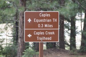 Caples Creek trailhead sign before Fitch Rantz Bridge